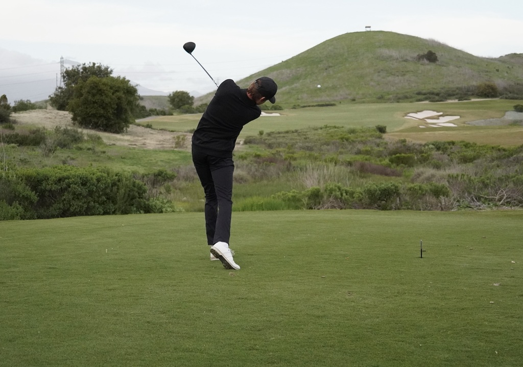 Gianni with his tee shot on hole 9.