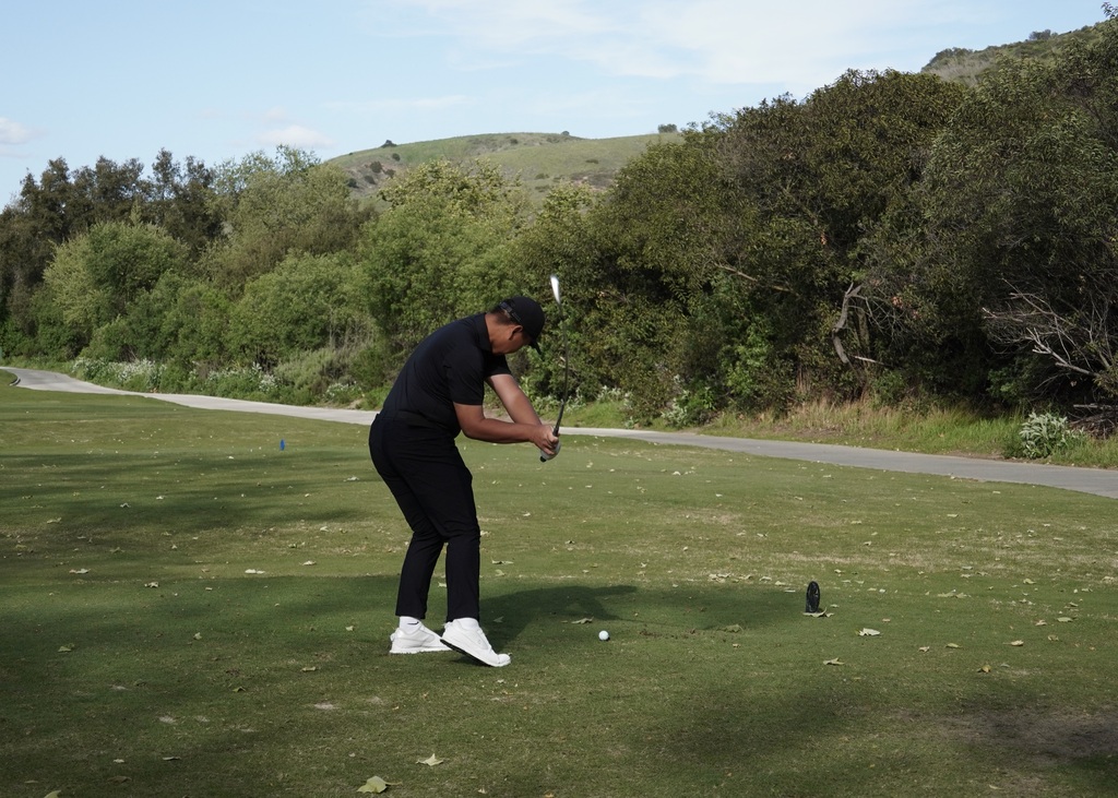Lucas Li on the tee box of hole 1.