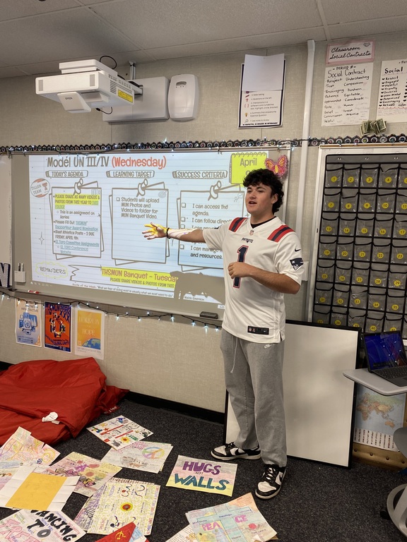 Presenting in class while showing school spirit for jersey day!