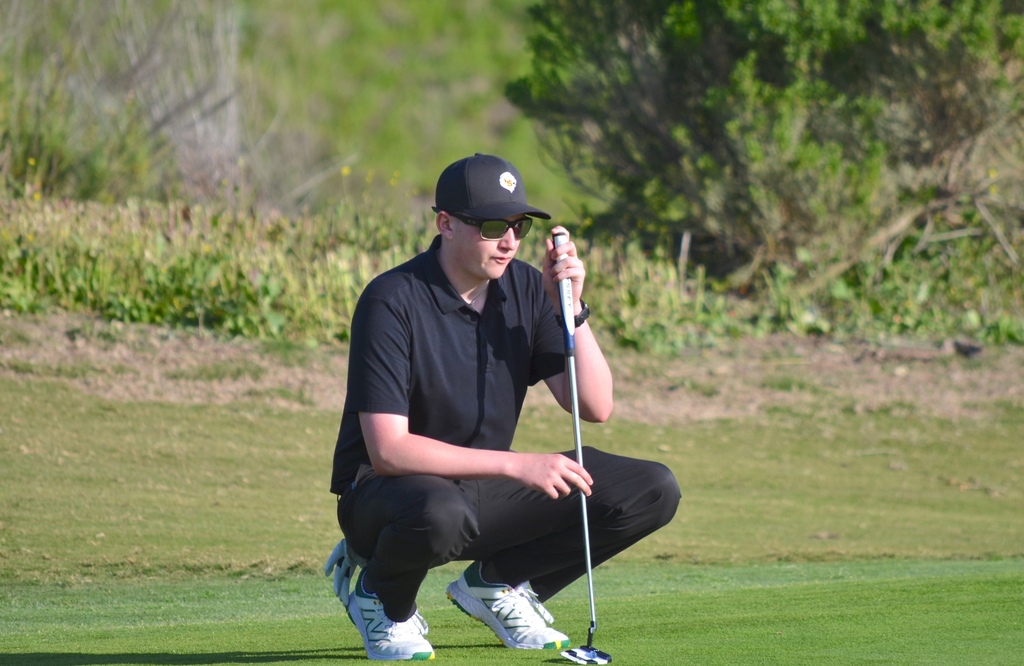 Colton lining up his next shot on hole 9.