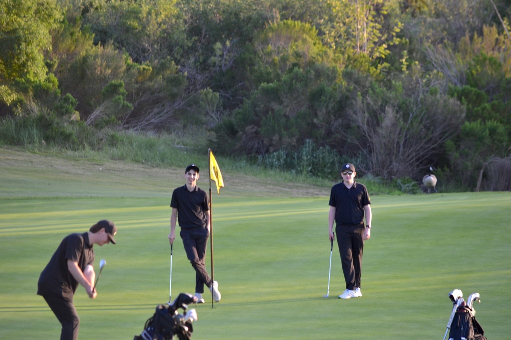 Grayson, Colton, and Ryan had a friendly competition after finishing their golf rounds.