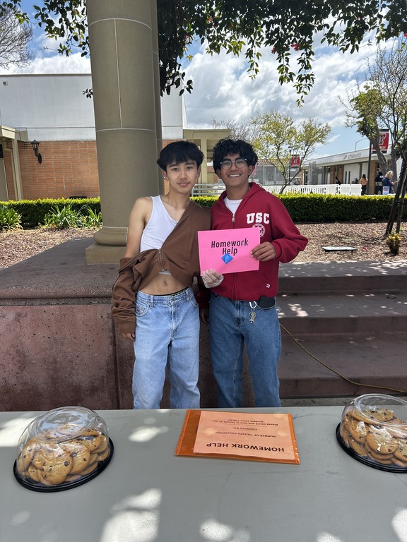 MUN Students Rahul and Remy selling food at food fair