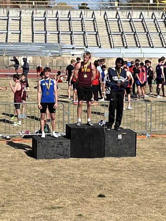 Kaiden Stroot finishes 3rd in the Boys Long Jump Elite Division at the WSU Shocker Pre State Meet on Friday.