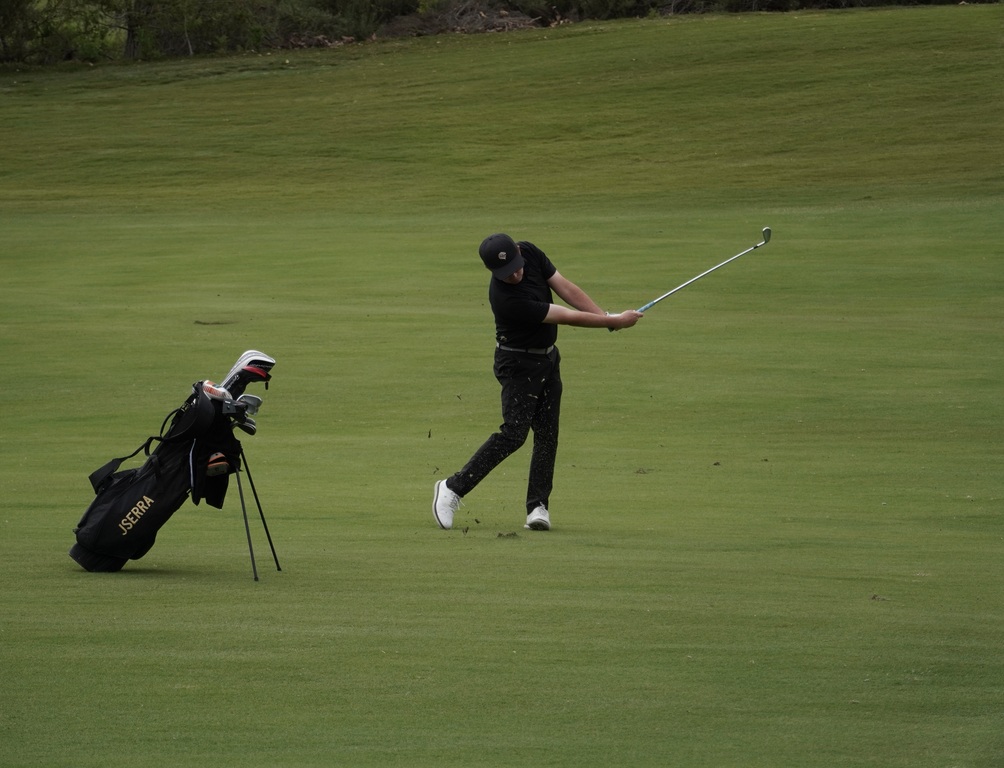 Liam McNamara with his approach shot into the green of hole 2.