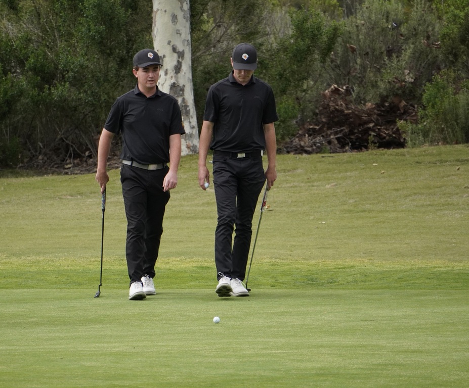 Adam and Liam on the putting green of hole 3.