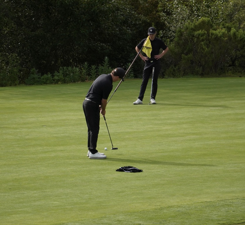 Liam and Adam on the putting green.
