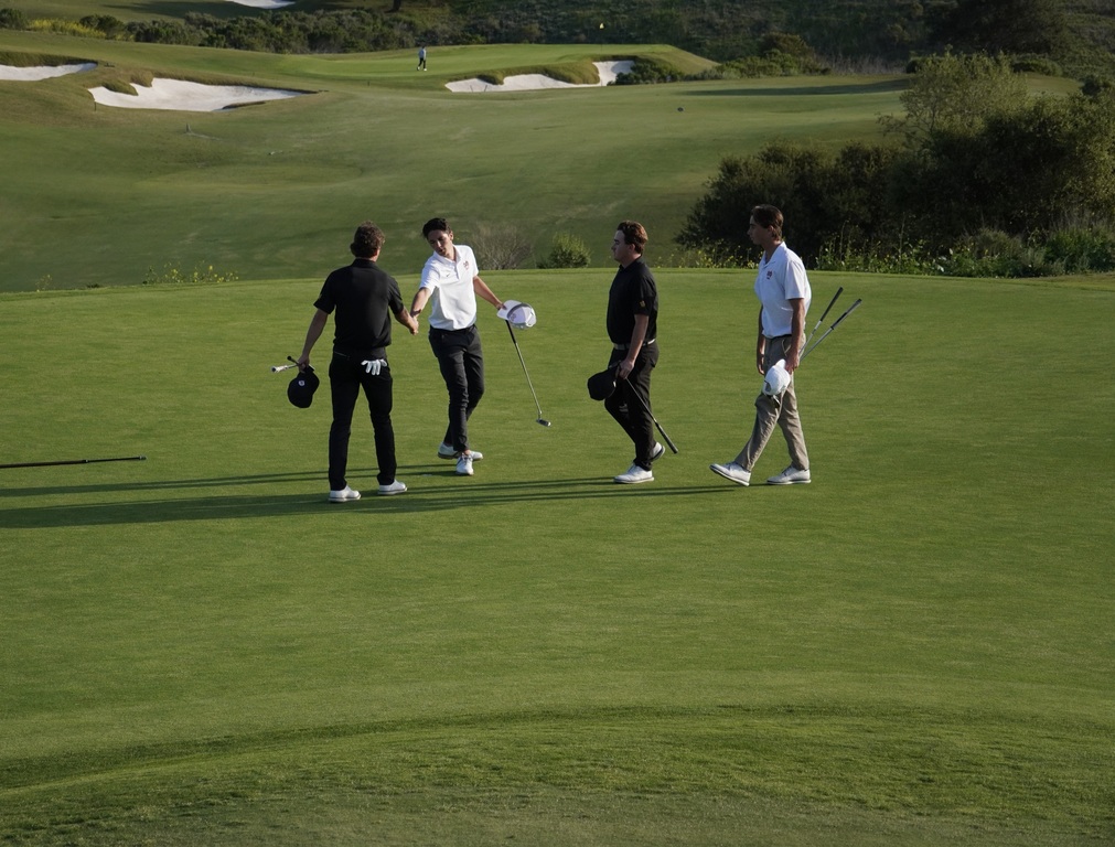 Shaking hand for the last time on hole 9.  Liam and Adam are graduating in a few weeks and plan to play club golf in college.