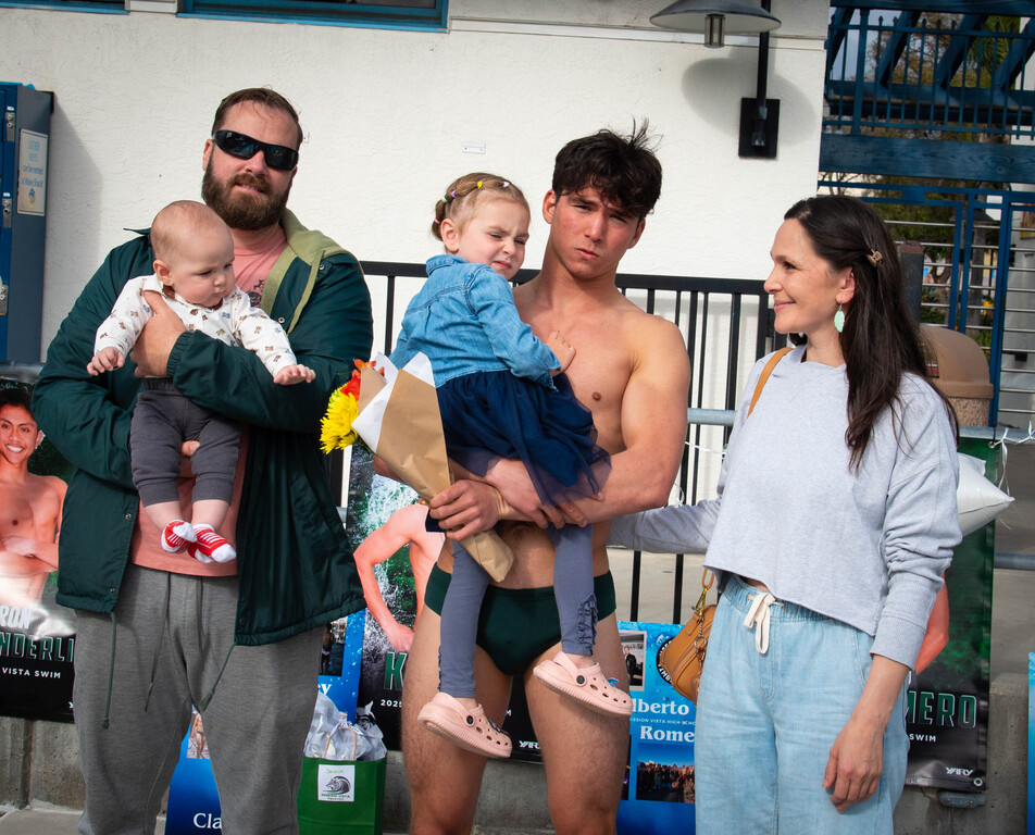 Senior night photo of Damir and his family