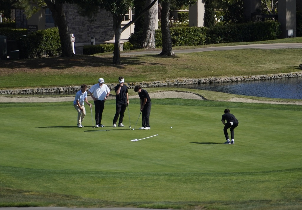 Some strategic putting involved for the boys going on with this 5 someone.  Competitive scramble between the two teams at the Senior Scramble!!