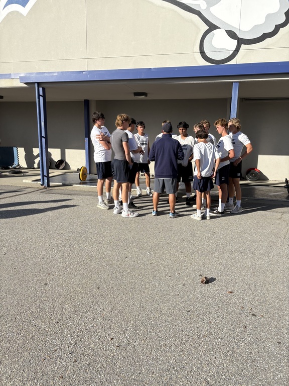 Joe talking with his athletes.
