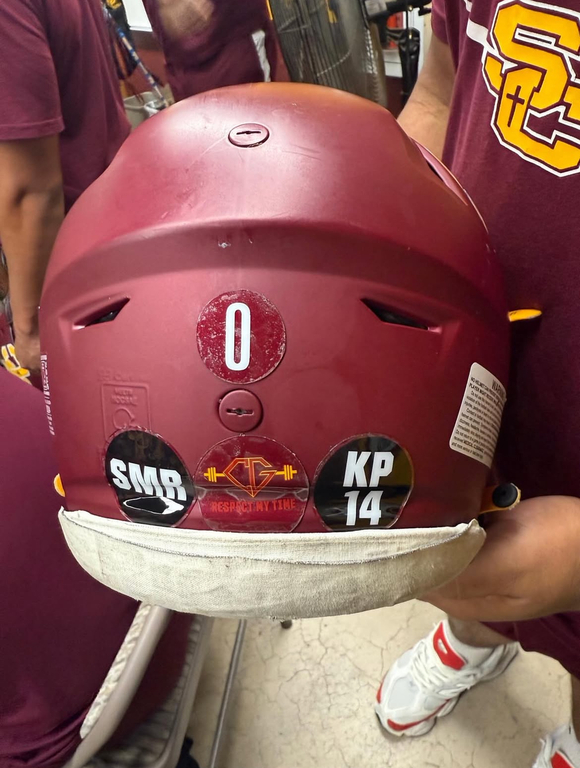 Tonight, we play with love and a united purpose.
We honor the memory of Suzan Rutherford (SMR), beloved mother of Coach Garrett, and stand beside Coach Garrett with unwavering support (CG).
We also remember Coach Kelly Pierce (KP14) sister, aunt, friend, 