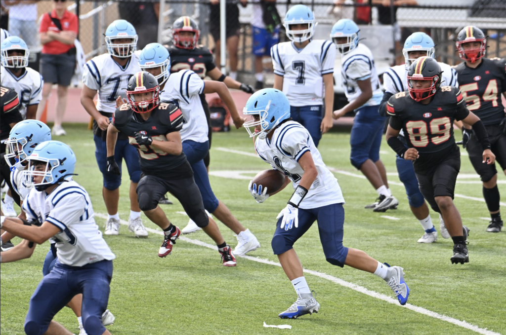 #4 Aidan Guzman runs downfield for Uni's JV team.