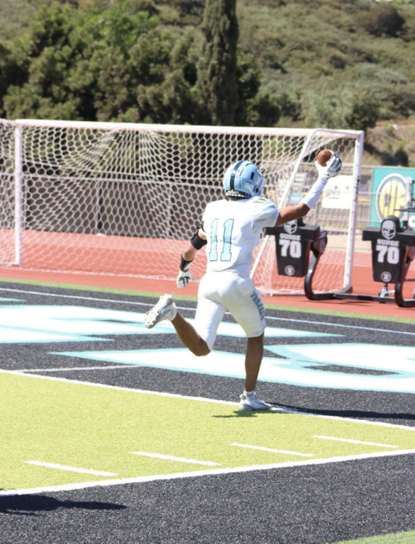 #11 Arvin  Jahangiri has the play of the day with a 31 yard catch scampering down the sidelines and scoring the Trojans sole touchdown and his first Varsity TD.