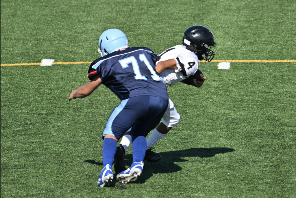 Rey Rodriguez brings down the Los Amigos player