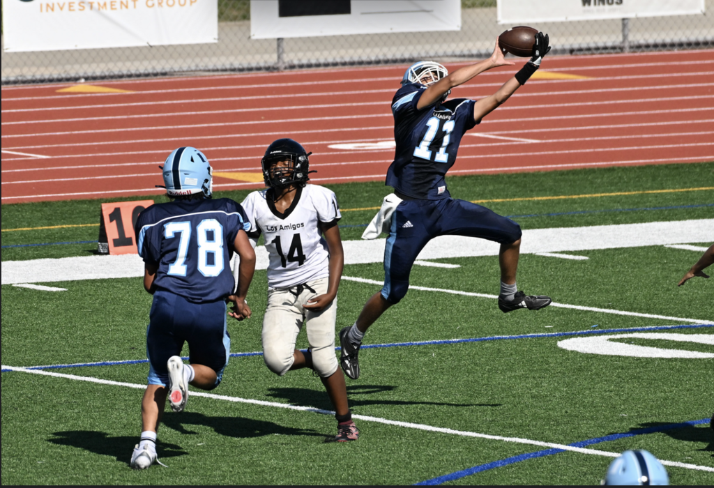 Freshman Chase Heale leaps to grab interception