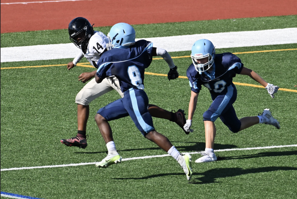 Running Back Noah Thomas finds the end zone in the Trojans Frosh victory