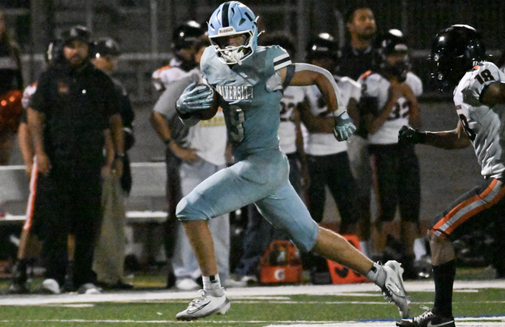 Trojans Lucca Clouthier busts out for a 30 yard run