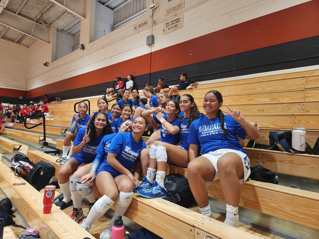 Varsity blue cheering the JV team on.
