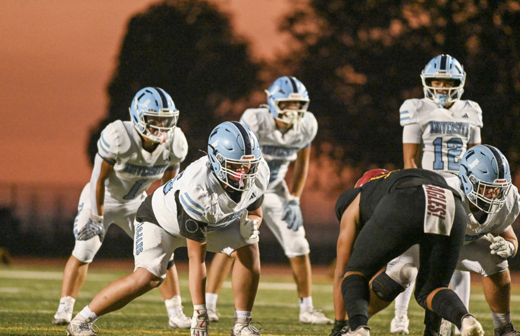 #75 Chenxuan Xu and the Offense gets in formation under the Costa Mesa sunset.