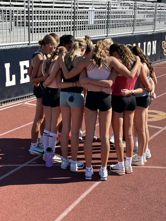Woodbridge Week!  Team prayer before Monday's workout on the track..