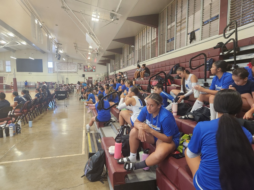 Blue & White Varsity cheering JV on.