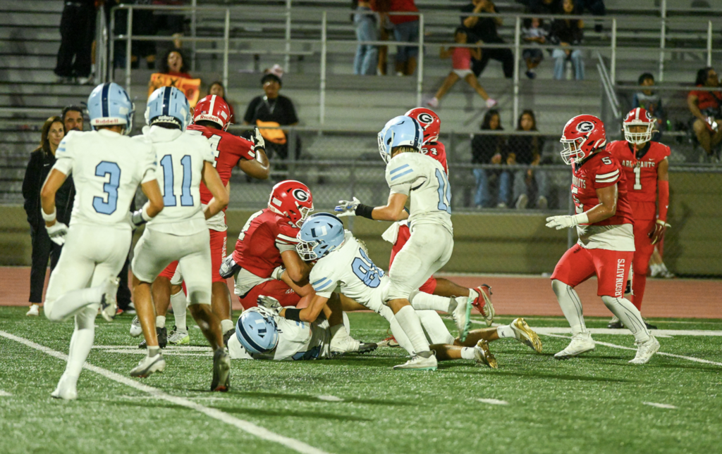 #81 Trevor Pattock got in on the tackle for University