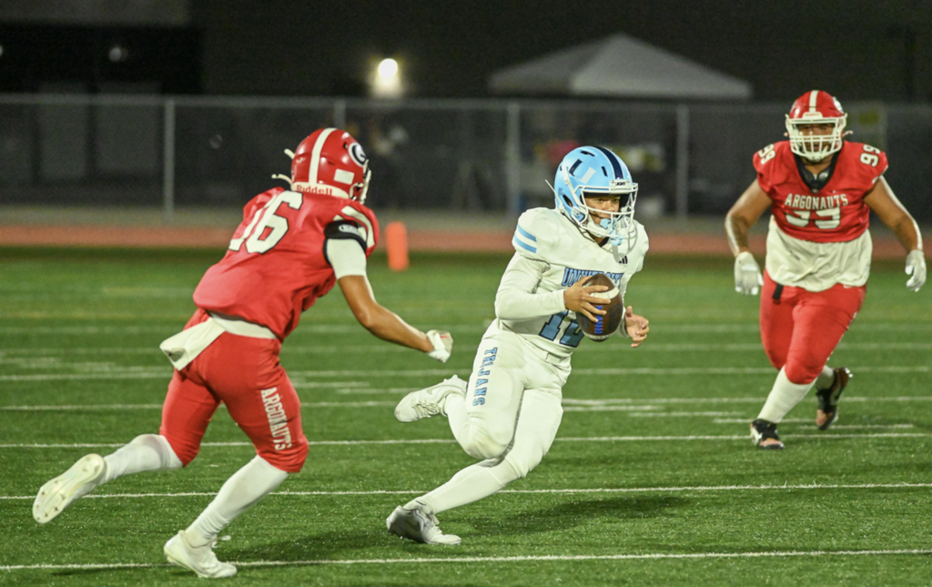 #12 QB Dylan Elmer scrambles forward for a big gain
