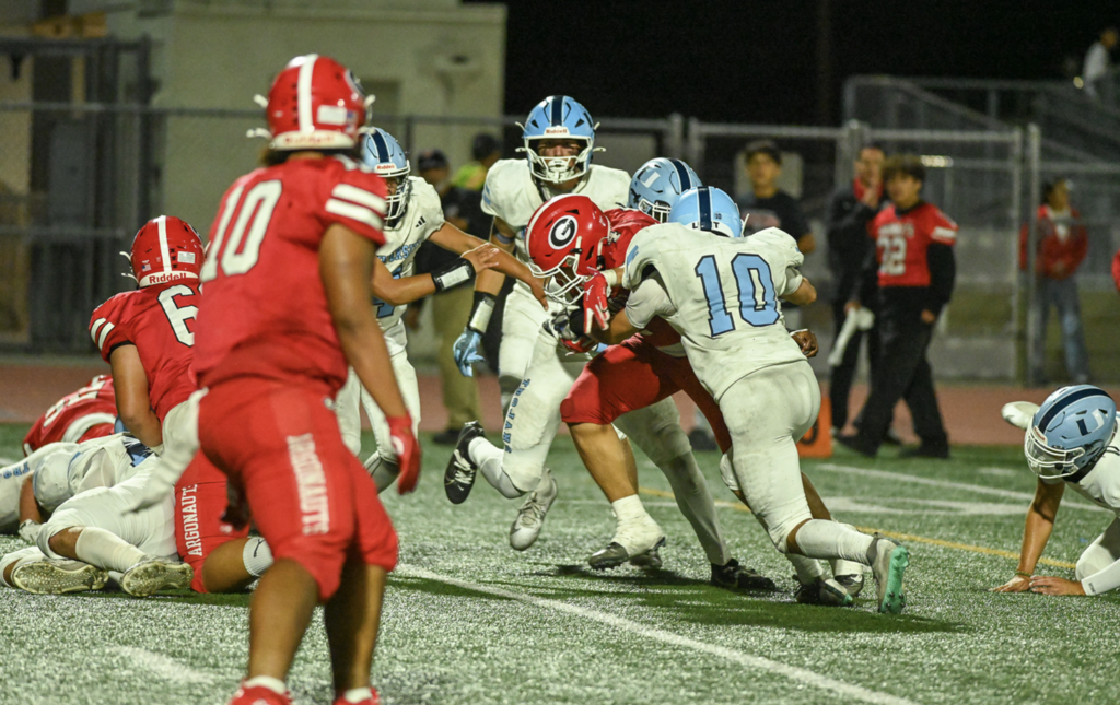 #10 Linebacker Pierce Fornier makes a big tackle for the Trojans