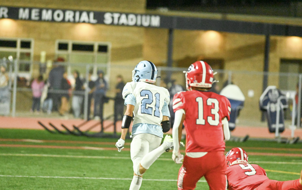 #21 Senior Captain Wide Receiver Cruz McMullens smokes past the Argonauts defenders for the play of the game and a 69-yard touchdown