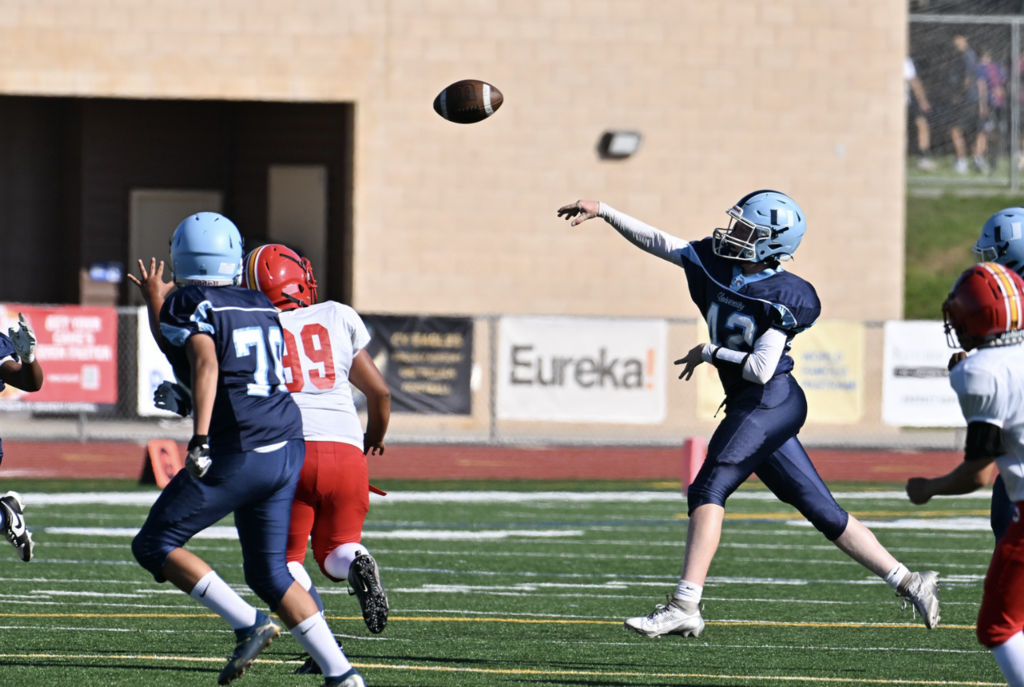 #12 QB Metchor Mathison fires off a pass in the Frosh Trojans 14-8 victory over the  Panthers