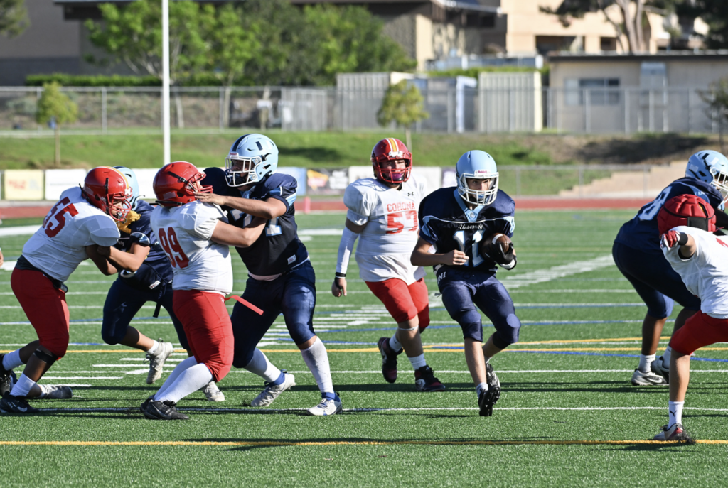 #10 Chase Tobin turns upfield towards the endzone