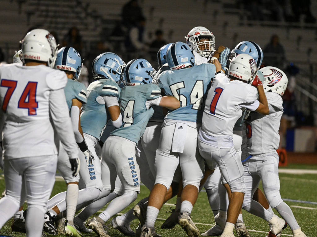 Senior Captain #54 Max Encheff brings the whole gang to tackle the Eagles ball carrier