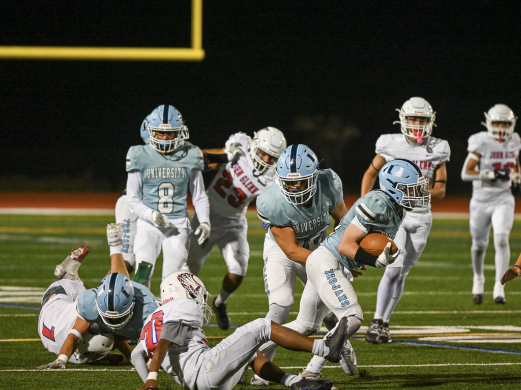 #14 Charlie Carmichael makes the catch and had a big kick return for the Trojans