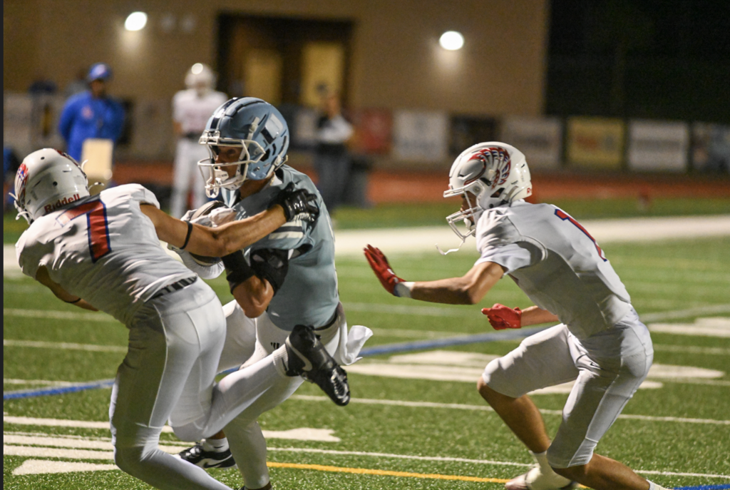 Senior Captain Arvin Jhahagiri splits the defenders for one of his 2 TDs in the evening.  Fo more great photos visit:  https://unifootballboosters.smugmug.com/20252026-UNI-TROJANS-FOOTBALL/Varsity