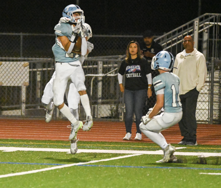 Senior Captain Cruz McMullens goes up high to make a spectacular catch. For more great photos, visit:  https://unifootballboosters.smugmug.com/20252026-UNI-TROJANS-FOOTBALL/Varsity