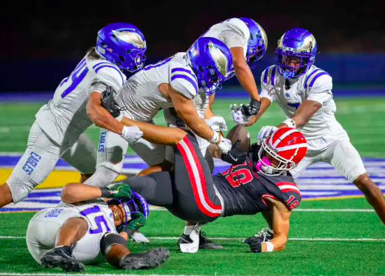 Santa Margarita defenders swarm Mater Dei tight end Mark Bowman to stop him cold in the fourth quarter in Santa Ana on Friday, Oct. 10, 2025. (Photo by Paul Rodriguez, Contributing Photographer, OC Register)