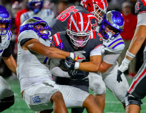 Santa Margarita defensive end Simote Katoanga, left, keeps Mater Dei running back Justin Lewis, right, from getting any yardage in Santa Ana on Friday, Oct. 10, 2025. (Photo by Paul Rodriguez, Contributing Photographer, OC Register)