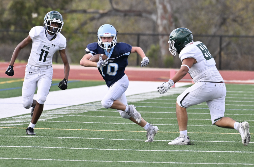 #10 Chase Tobin splits defenders of the Coyotes.  For more photos visit:  https://unifootballboosters.smugmug.com/20252026-UNI-TROJANS-FOOTBALL/2025FROSH