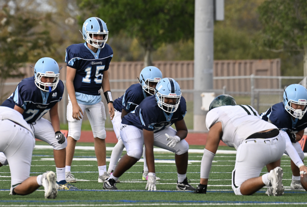 QB VItor Campos and the offensive line get ready for the snap.  Trojan Chase Heale with the reception as he catches and turns upfield down the sidelines. For more photos visit: https://unifootballboosters.smugmug.com/20252026-UNI-TROJANS-FOOTBALL/2025FROS