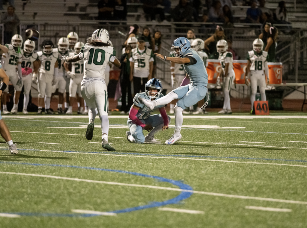 #2 Jake Rabold gets the Trojans out to the early lead with a field goal.   For more great photos of this game and season visit: https://unifootballboosters.smugmug.com/20252026-UNI-TROJANS-FOOTBALL/Varsity