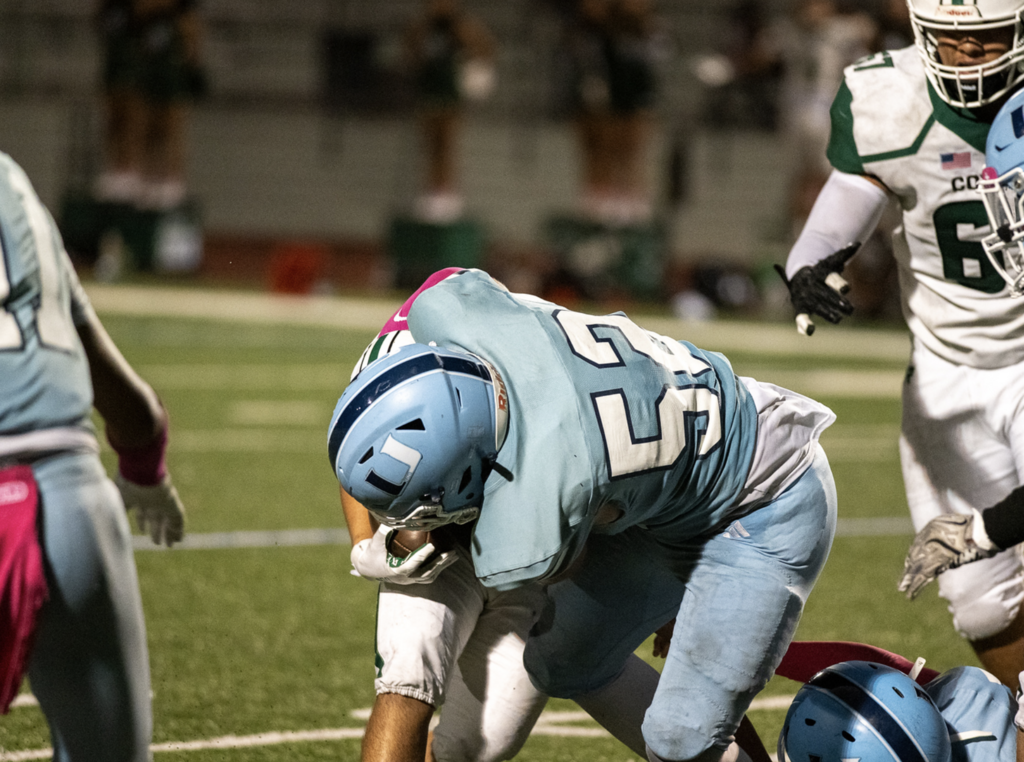 #52 Adham Osman makes the tackle against Buena Park.   For more great photos of this game and season visit: https://unifootballboosters.smugmug.com/20252026-UNI-TROJANS-FOOTBALL/Varsity