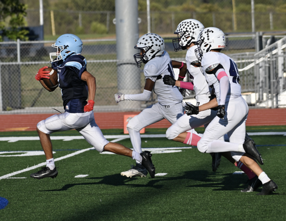 Portola defenders can't catch running back #1 Ahmad Muqtader Amadi.  For more photos, visit: https://unifootballboosters.smugmug.com/20252026-UNI-TROJANS-FOOTBALL/2025FROSH
