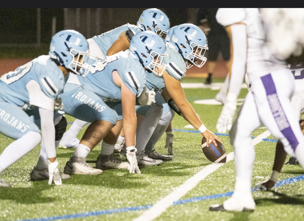 Offensive Line takes ready position against the Portola Bulldogs.  For more great photos of this game and season visit: https://unifootballboosters.smugmug.com/20252026-UNI-TROJANS-FOOTBALL/Varsity