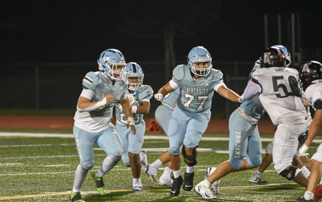 Offensive Tackle #77 Senior Casey Kunin faced adversity all-season long with an injury, but was able to make an appearance in his final high school game.  For more great photos of this game and season visit: https://unifootballboosters.smugmug.com/2025202
