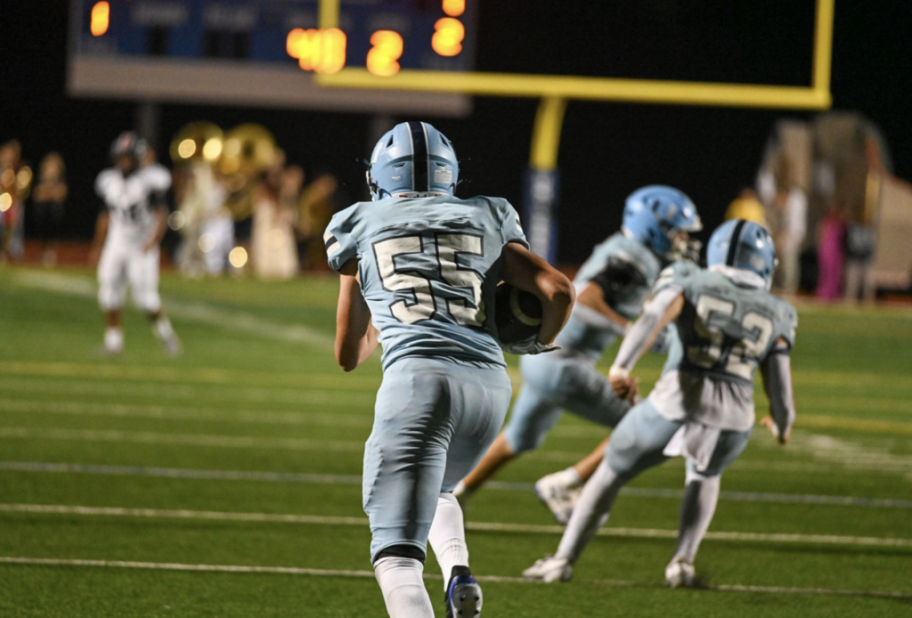 #55 Senior Luke Emrich showed to be a freight train to bring down running back a kick 45 yards in the season finale.For more great photos of this game and season visit: https://unifootballboosters.smugmug.com/20252026-UNI-TROJANS-FOOTBALL/Varsity