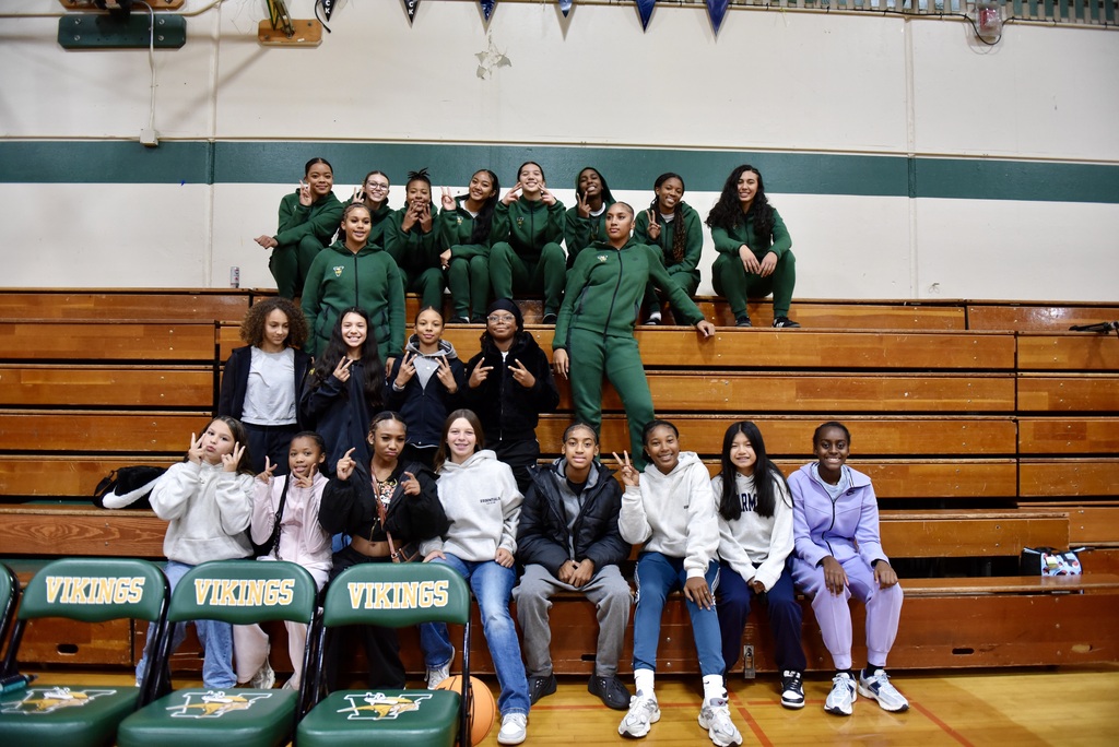 GOLDEN WEST GIRLS BASKETBALL TEAM WITH THEIR BIG SISTER AT VANDEN VARSITY GIRLS BASKETBALL TEAM GAME .