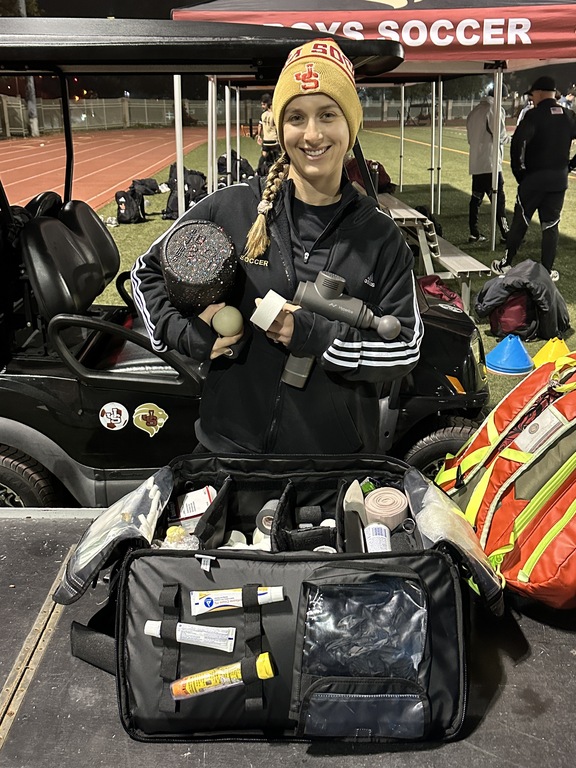 Kasey, Sports Trainer Extraordinaire, keeping our boys safe and tuned up on the sideline !