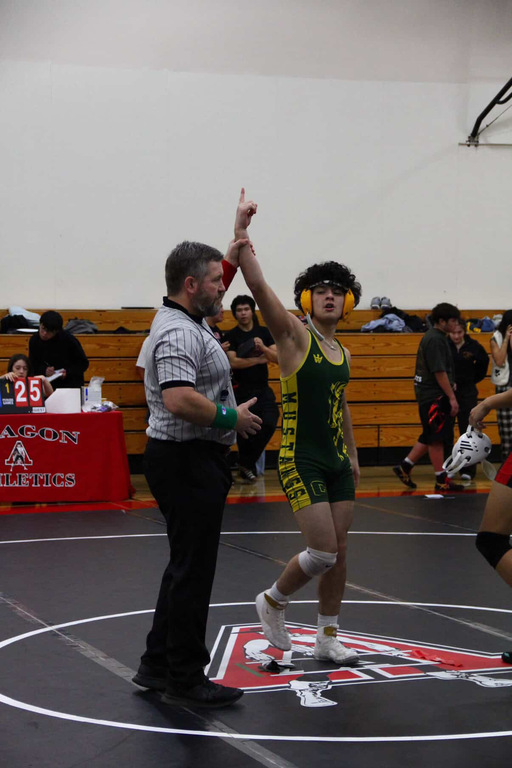 Ayden Osegueda securing the pin for the Mustangs