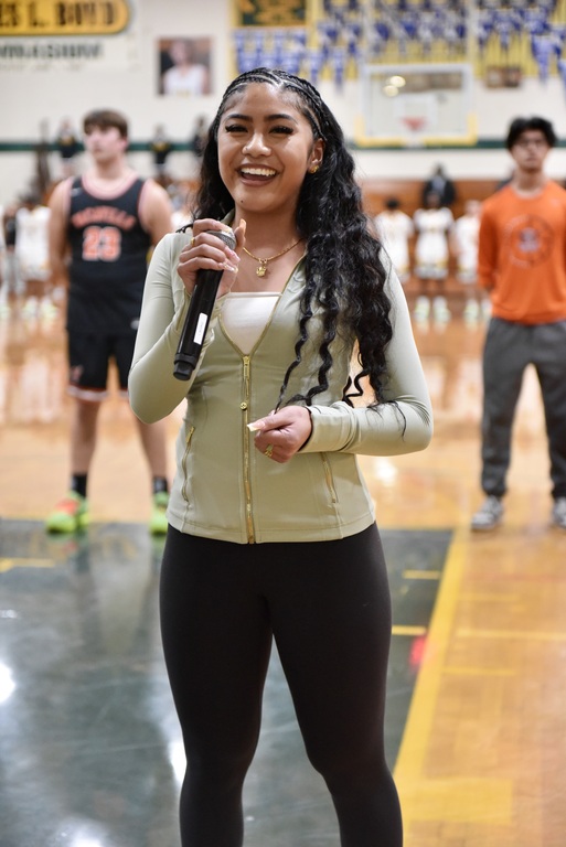 SENSATIONAL ANTHEM , NICOLE IGNACIO . SING AT THE BASKETBALL GAME VS VACAVILLE MAYBE , SOMEDAY SHE CAN HAVE A CONCERT, AT VANDEN WITH VANDEN JAZZ BAND PLAYING.