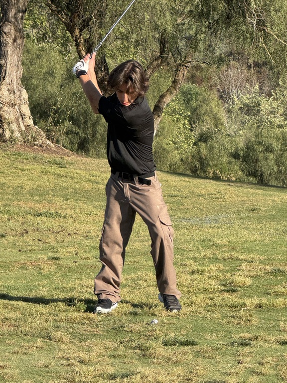 Dino taking a shot on 9. He did well for his first match! I look forward to seeing how low his scores can go.